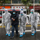 This photo taken on January 26, 2020 shows medical staff members wearing protective clothing to help stop the spread of a deadly virus which began in the city, accompanying a patient (2nd L) as they walk into a hospital in Wuhan in China’s central Hubei province.